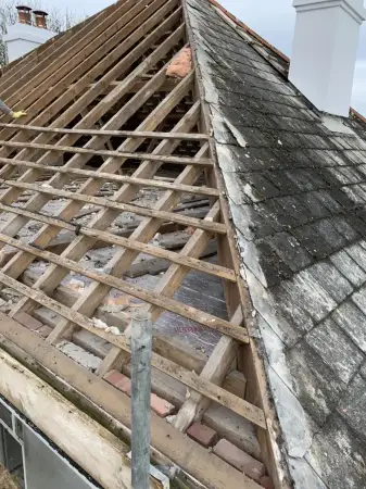 Click Here To Enlarge This Photo Of Property Roof Being Stripped Ready For Felt and Battening